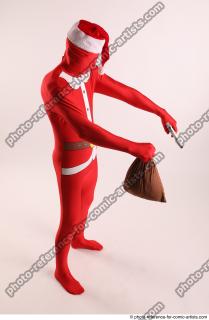 JOEL_ADAMSON CHRISTMAS VALLAIN WITH GUN AND BAG